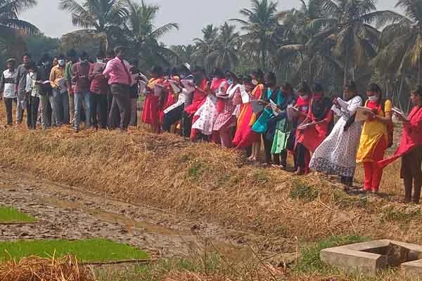 trimming and plastering of paddy field by the students